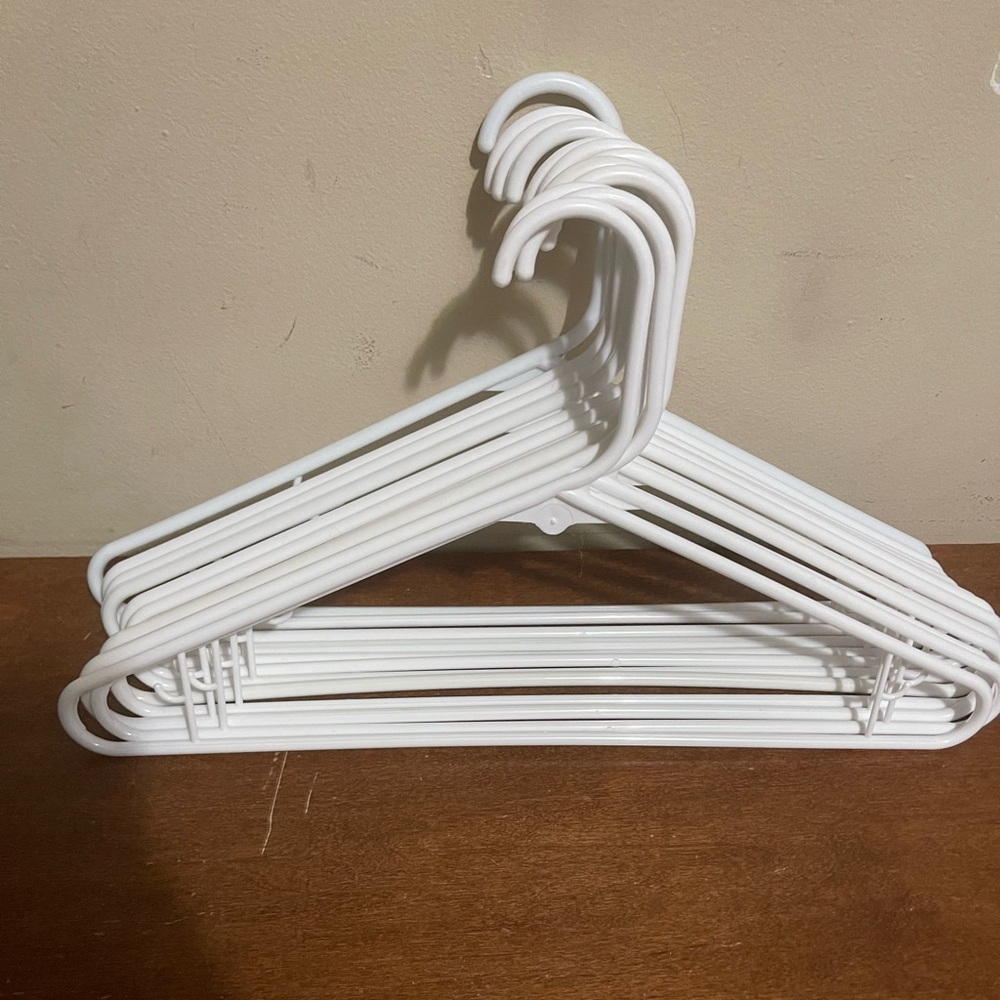 12 white plastic hangers